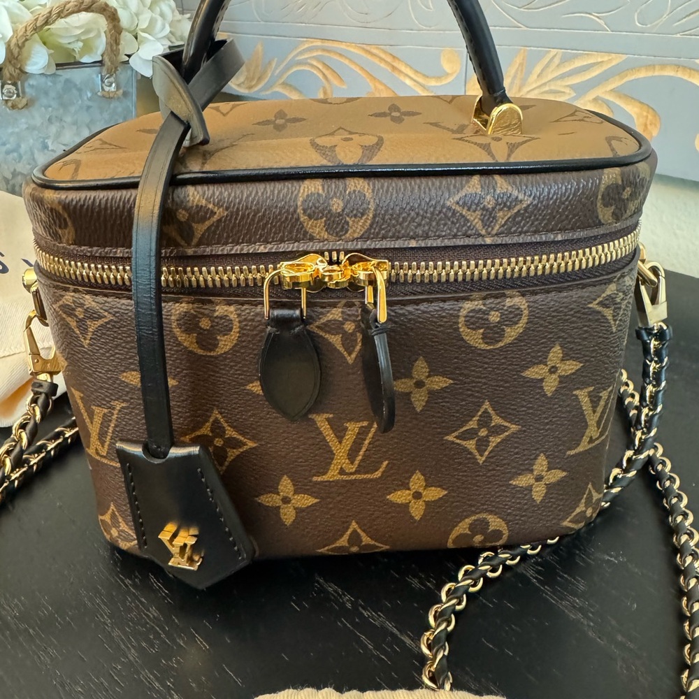 Authentic Louis Vuitton Vanity PM in Reverse Monogram canvas.